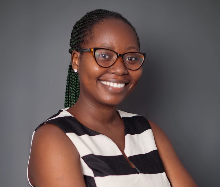 A woman with glasses and a striped shirt