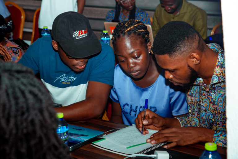 A group of people sitting around a table.